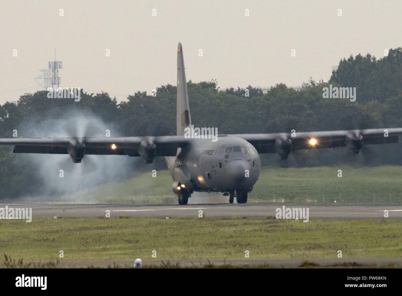 A C-130J Super Hercules touches down at Yokota Air Base, Japan, Sept. 20, 2017. This is the fifth C-130J delivered to Yokota and the first from Ramstein Air Base. Crewmembers from the 36th Airlift Squadron flew halfway around the world to deliver an aircraft here. Yokota serves as the primary Western Pacific airlift hub for U.S. Air Force peacetime and contingency operations. Missions include tactical airland, airdrop, aeromedical evacuation, special operations and distinguished visitor airlift. Stock Photo