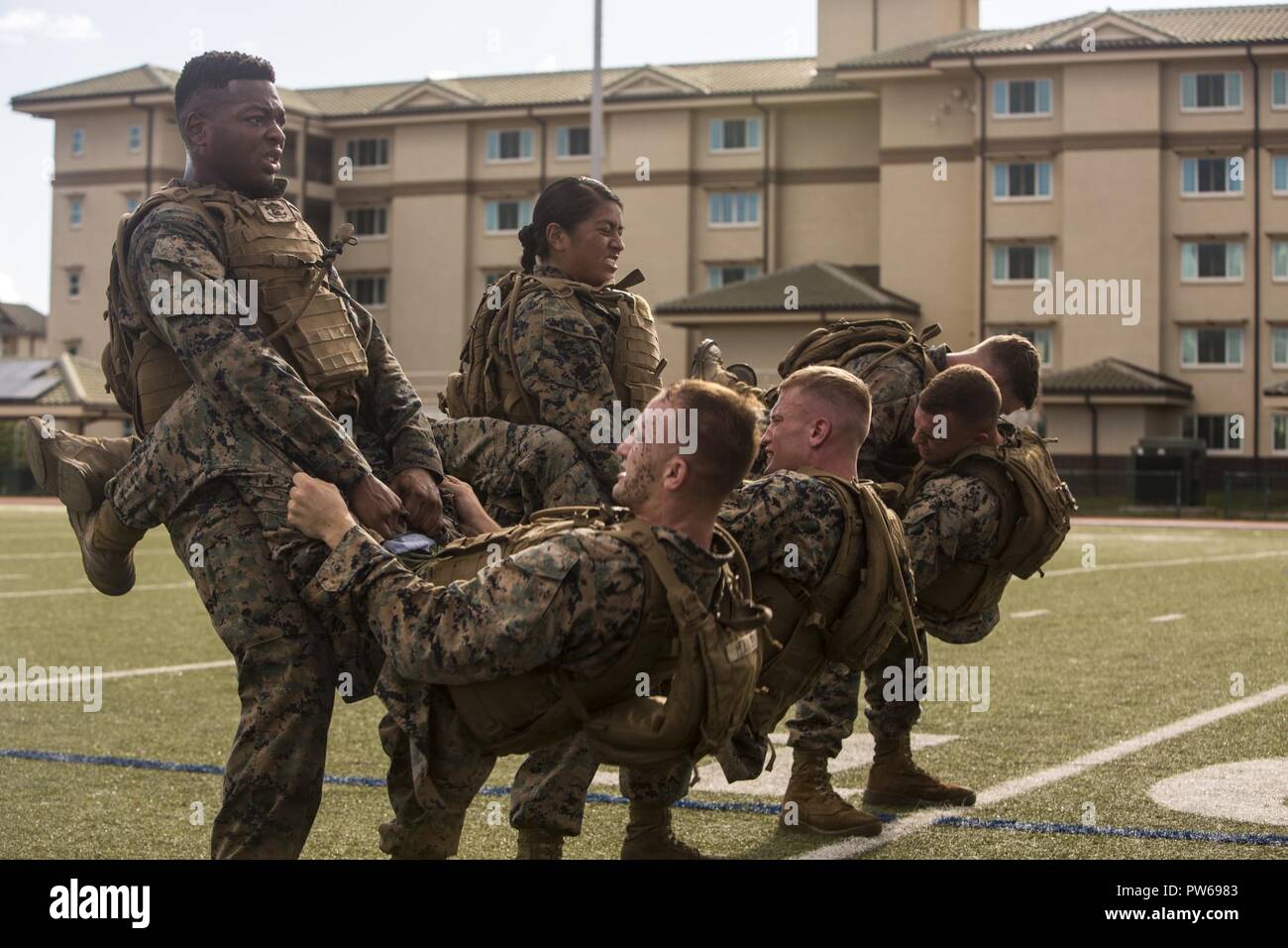 U.S. Marines conduct buddy sit ups during a Martial Arts Instructors Course MAIC Marine Corps Base Hawaii Sept. 25 2017. MAIC is a 3 week long course designed to enable Marines to teach their