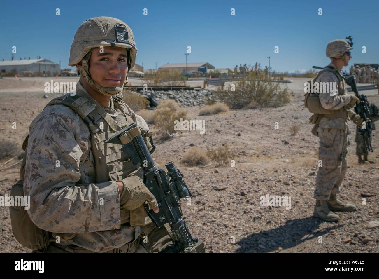 U.S. Marine Corps Lance Cpl. Jose Rodriguez, an infantry Marine with Kilo Company, 3rd Battalion, 1st Marines, prepares for a rehearsal raid during Weapons and Tactics Instructors Course (WTI) 1-18 at Yuma, Ariz., on Sept. 27, 2017. WTI is a seven week training event hosted by Marine Aviation and Weapons Tactics Squadron One (MAWTS-1) cadre which emphasizes operational integration of the six functions of Marine Corps Aviation in support of a Marine Air Ground Task Force. MAWTS-1 provides standardized advanced tactical training and certification of unit instructor qualifications to support Mari Stock Photo