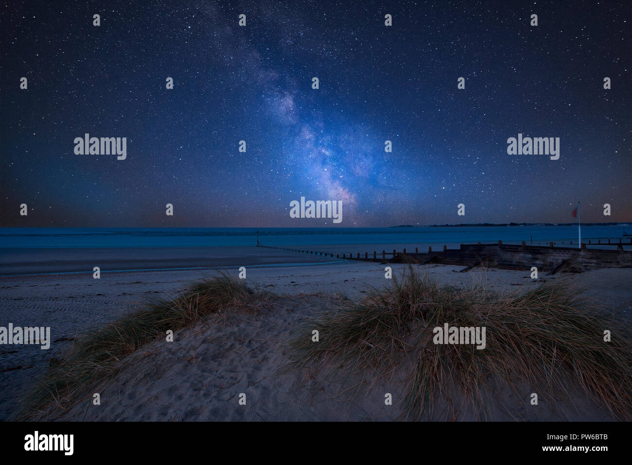 Stunning vibrant Milky Way composite image over landscape of beautiful ...