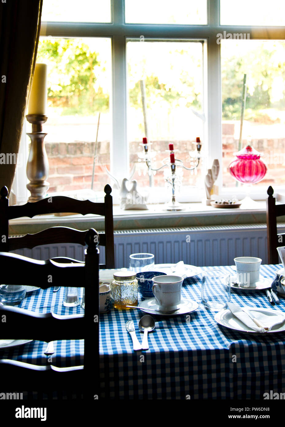 traditional English breakfast table set against window,interior of old