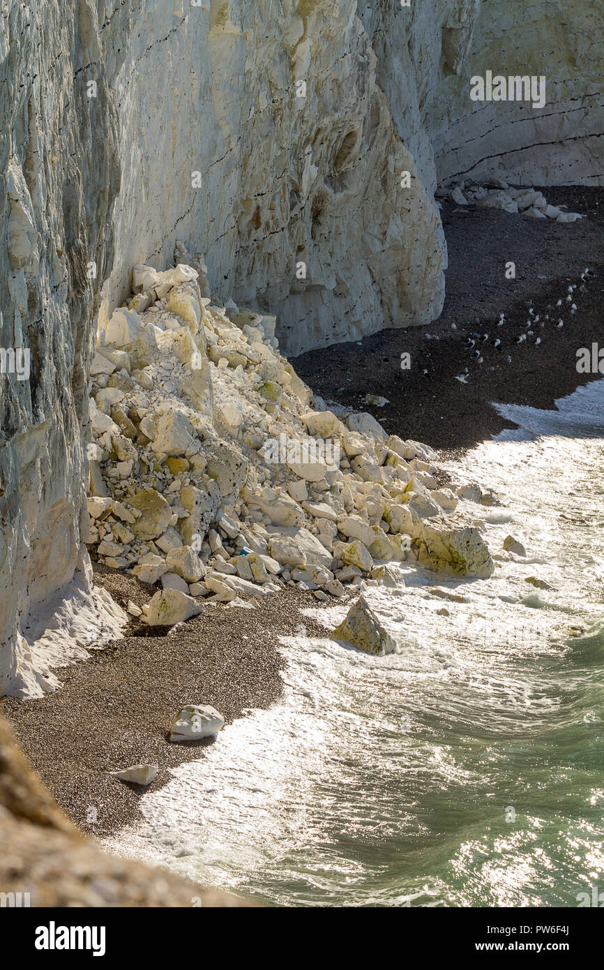 Seaford head UK cliff erosion crumbling chalky cliffs take a battering from the elements sea wind and rain. Weathered surfaces show flint rocks within Stock Photo