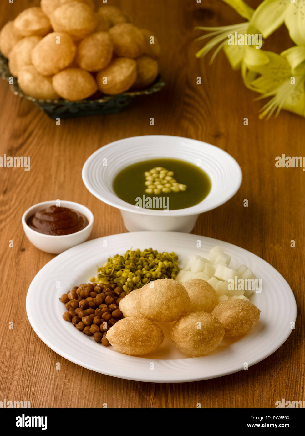 PANI PURI, FRIED BALLS MADE FROM WHEAT SERVED WITH WITH RED CHANNA