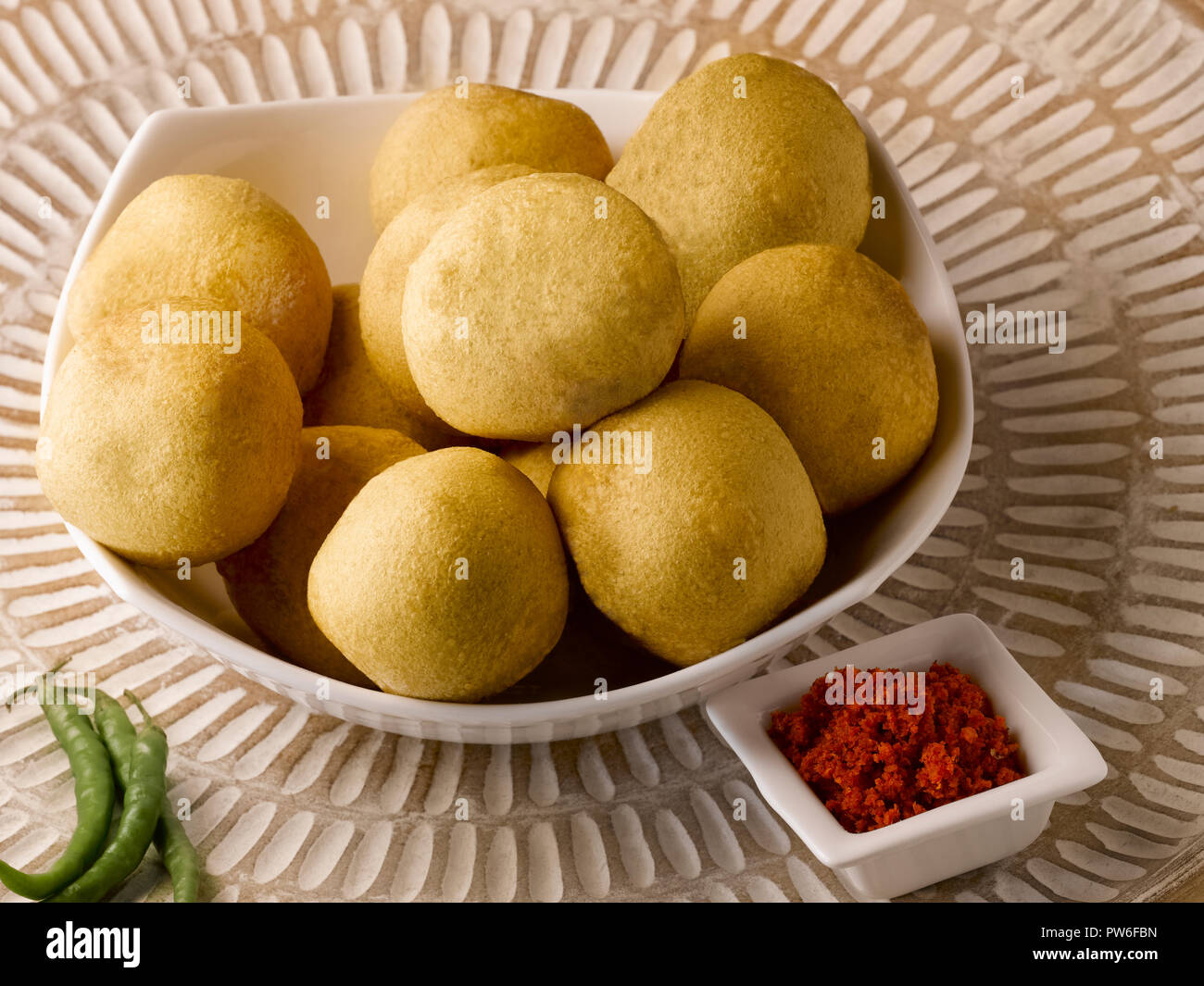BATATA WADA, POTATOES COVERED WITH GRAM FLOUR, DEEP FRIED, SERVED WITH