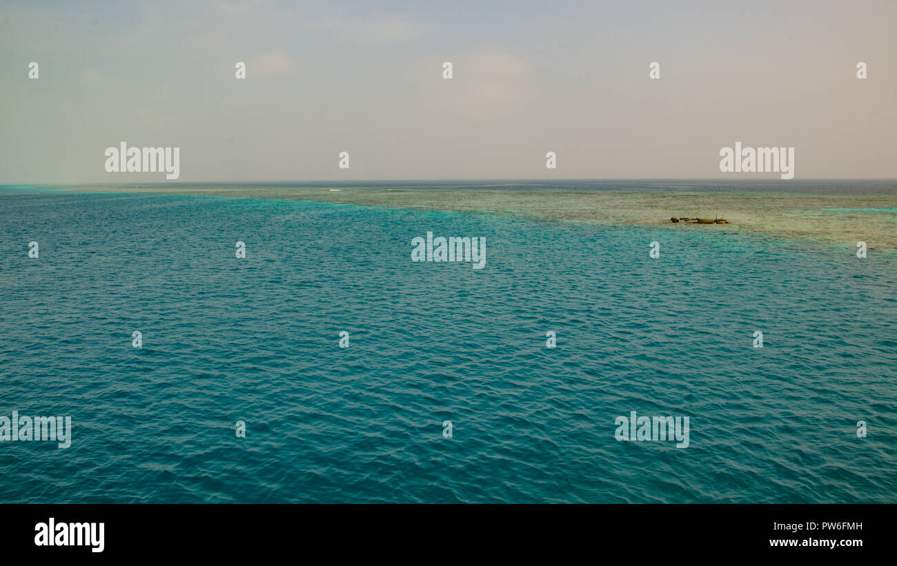 Angarosh, Sudan - April 2018. Blue sea close to the reef. Stock Photo