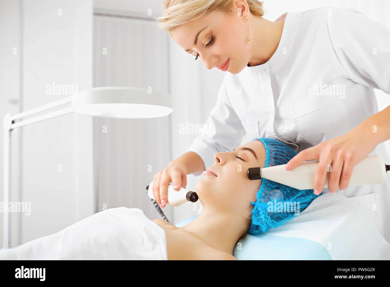 Hardware cosmetology for woman face. Stock Photo
