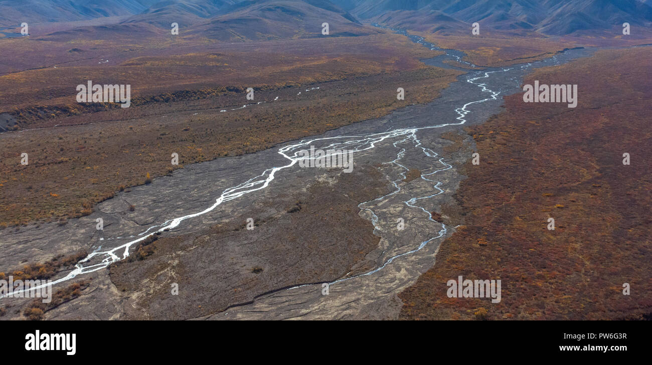 braided river coursing through valley in Denali National Park and Preserve in fall Stock Photo