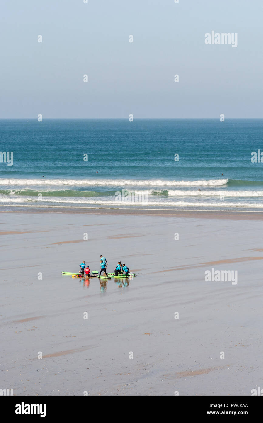 Surfers at Newquay, Cornwall. Cornwall beach sea sky. Stock Photo