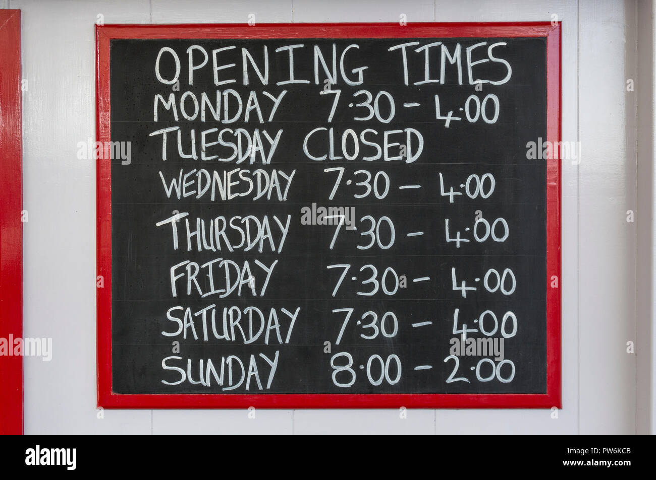 Opening Times sign at cafe in Newquay, Cornwall Stock Photo Alamy