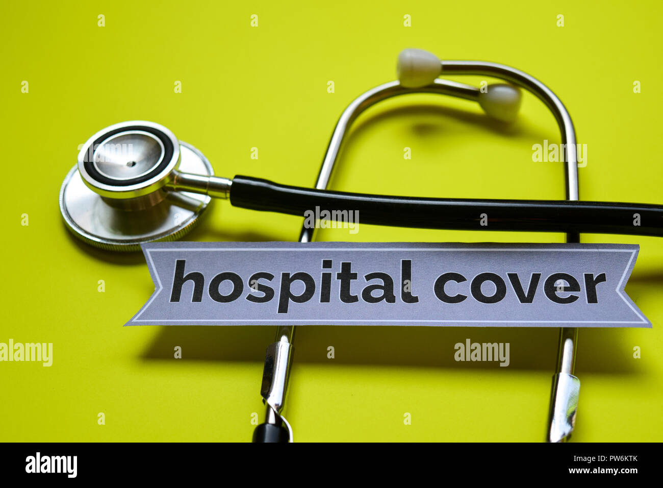 Hospital Cover with stethoscope concept inspiration on yellow