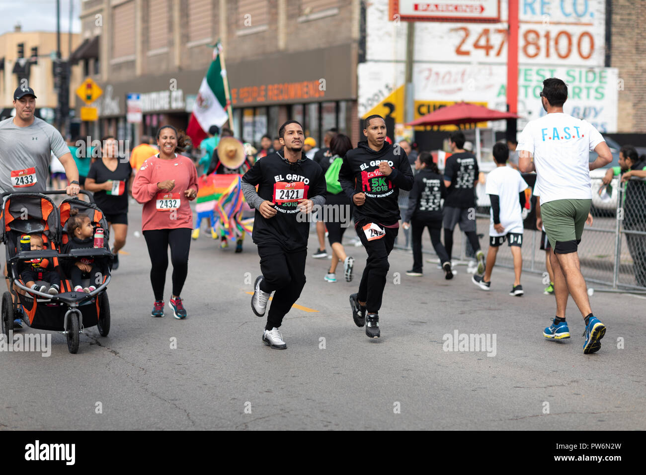 Chicago, Illinois , USA - September 9, 2018, El Grito 5K at la Villita, family run walk, men and women running in the annual 5 kilometers race, prior  Stock Photo