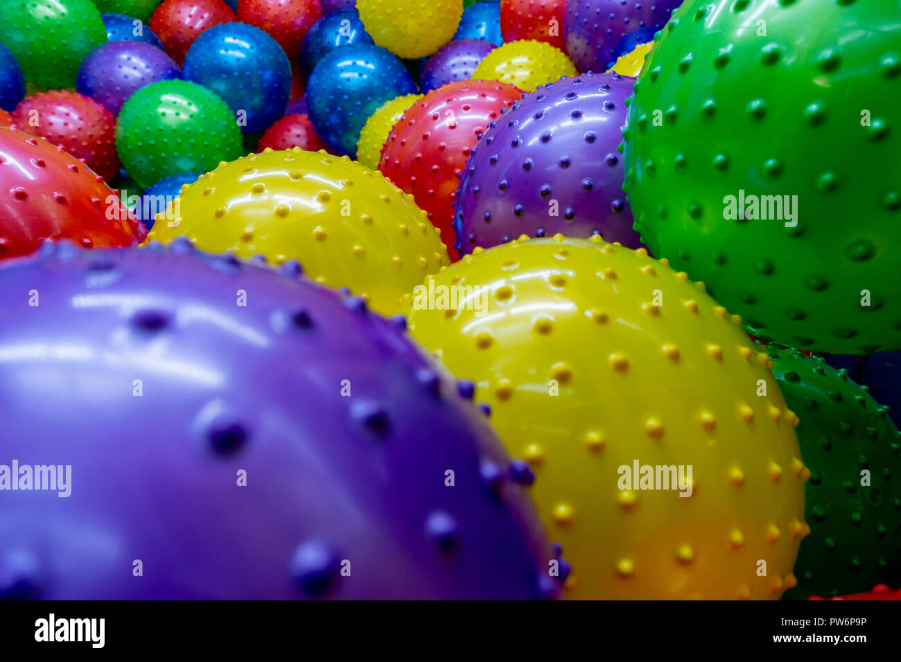 many kick balls together in one area wall to wall Stock Photo Alamy