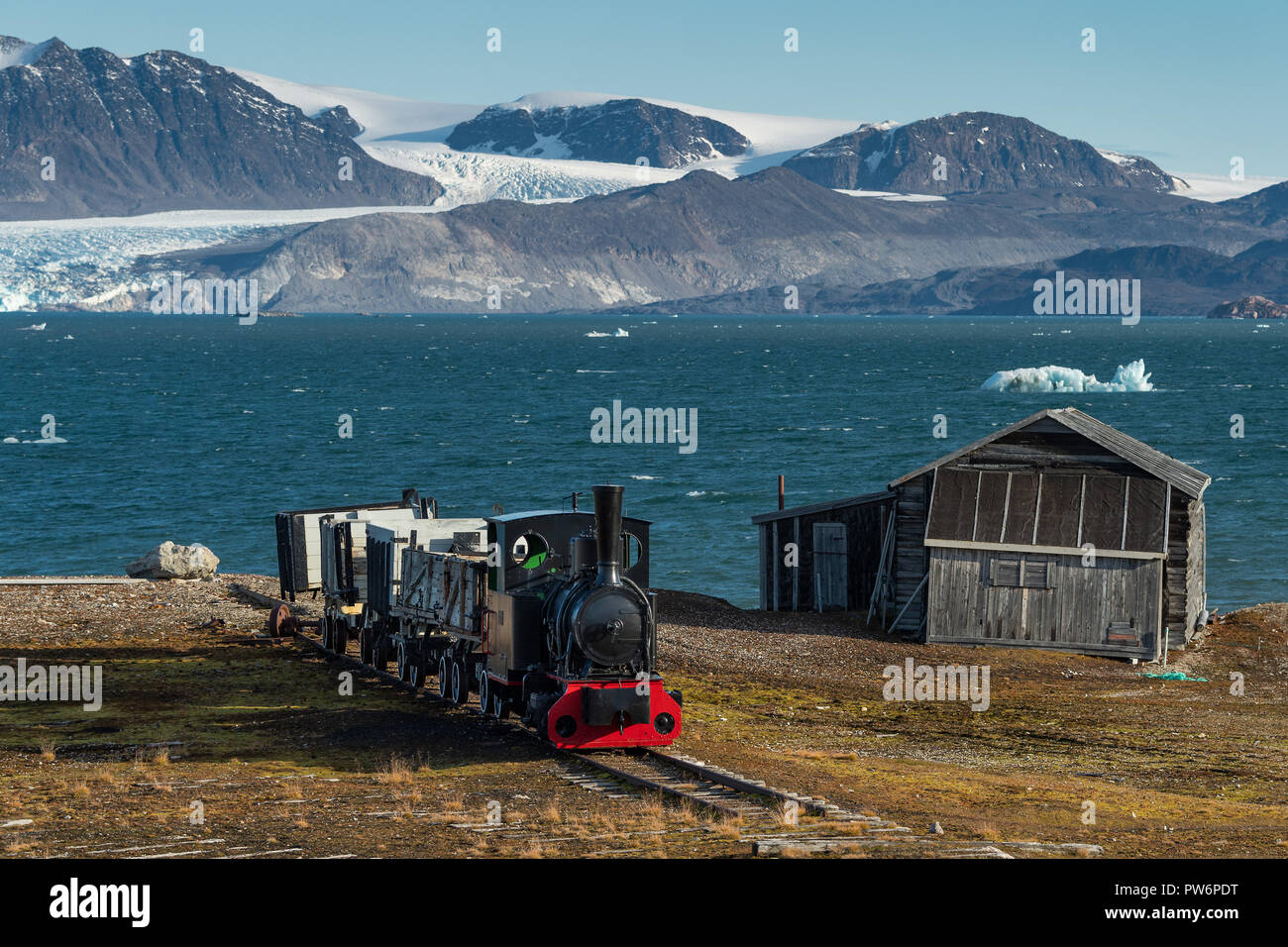 Historic mine train in front of the Kongsfjorden, NyAlesund, Spitsbergen, Svalbard Islands