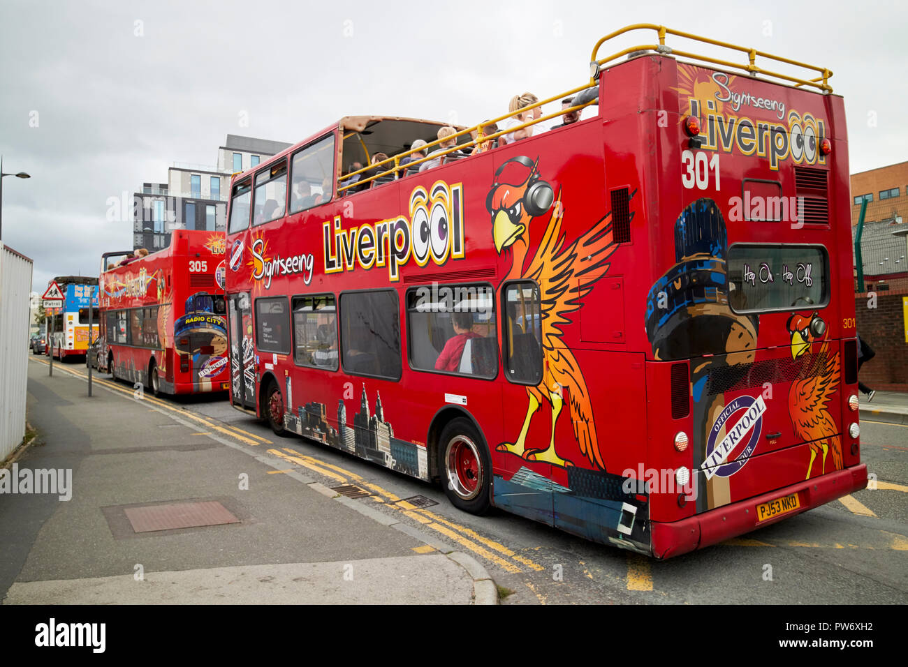 open top tours red city sightseeing tour busses in the knowledge quarter Liverpool merseyside england uk Stock Photo