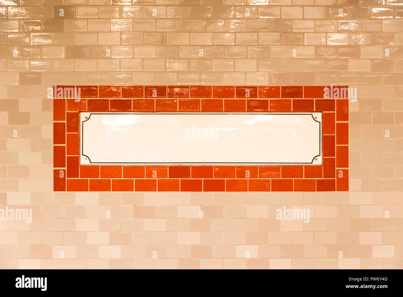 White rectangular panel with copyspace on a tiled wall Stock Photo