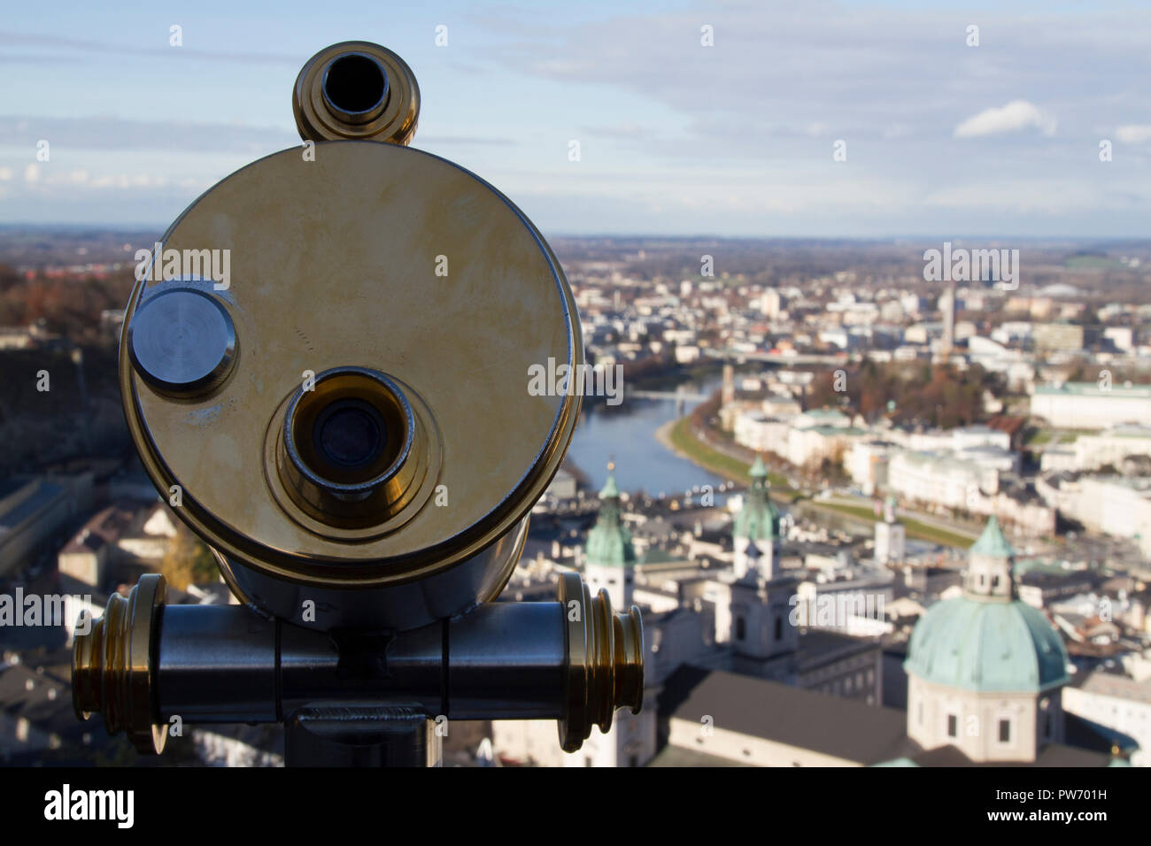 Close up of a telescope, with a view of Salzburg from Fortress Hohensalzburg Stock Photo