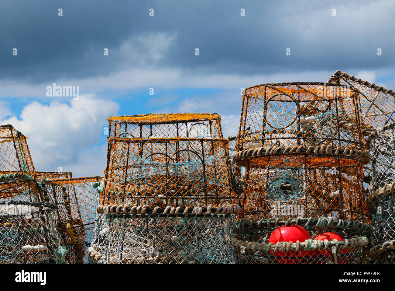 A pile of lobster / crab pots on the quayside at Newquay harbour, Cornwall, England, UK Stock Photo
