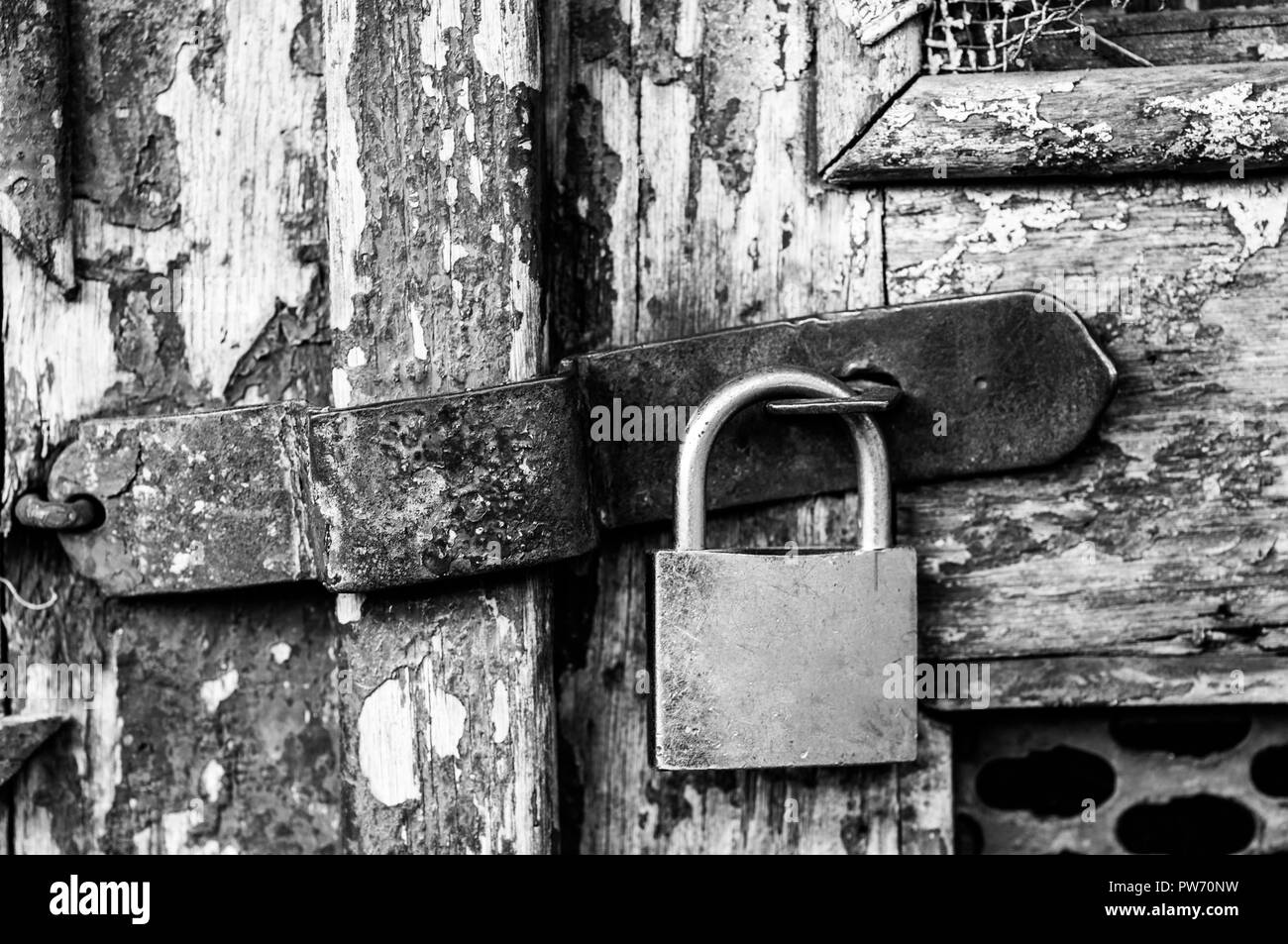 Brass padlock Black and White Stock Photos & Images - Alamy