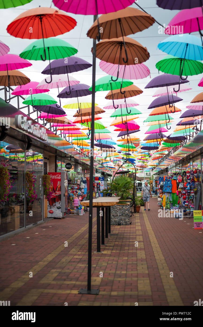 ADLER, RUSSIA - SEPTEMBER, 2018: alley soaring Umbrellas in Sochi. This location is popular with tourists. Stock Photo