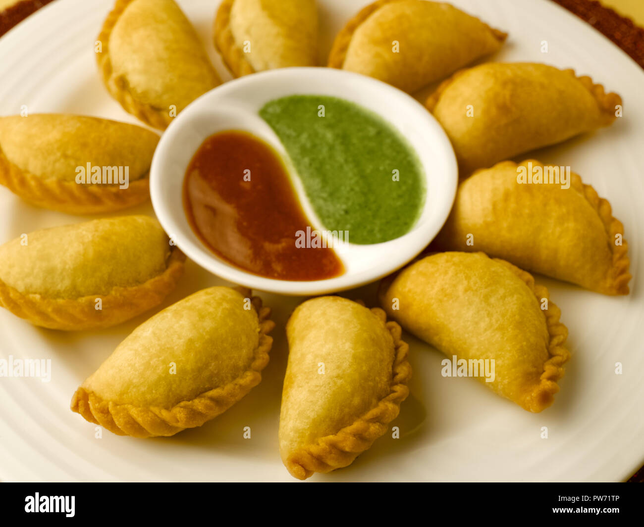 GHOOGHARA WITH DATE AND CORIANDER CHUTNEY Stock Photo Alamy