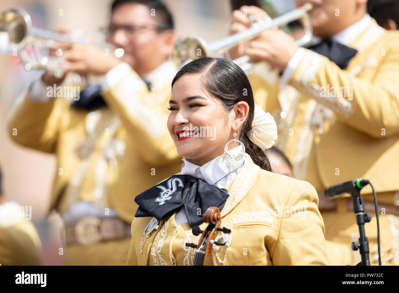 Chicago, Illinois , USA - September 9, 2018 The 26th Street Mexican Independence Parade, mexican women and men wearing traditional mariachi clothing p Stock Photo