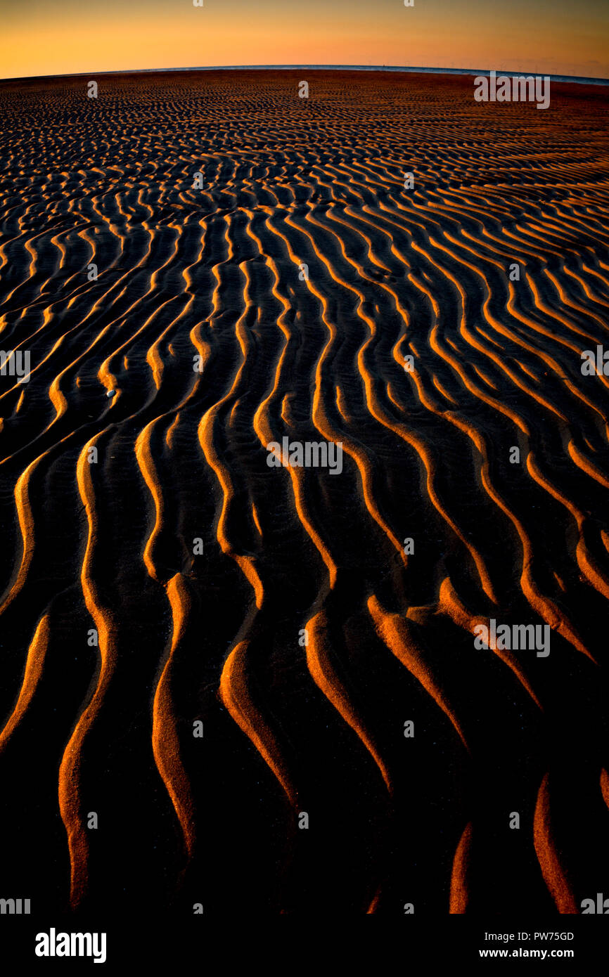Ripples in the sand at sunset on Talacre beach, North Wales Stock Photo