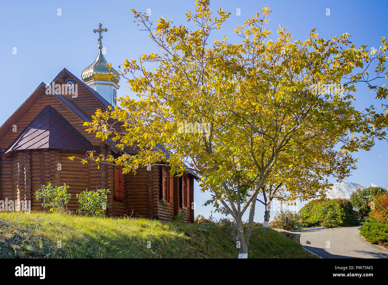 Small wooden rural church in autumn. No people Stock Photo