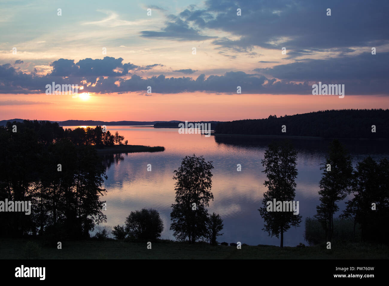 Sunset over the lake Stock Photo - Alamy