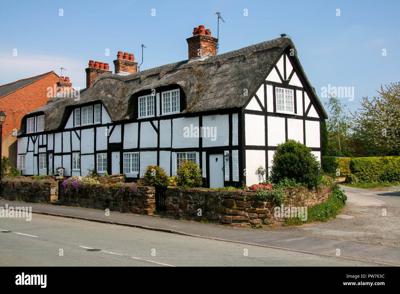 Traditional Cheshire black and white half timbered thatched roof ...