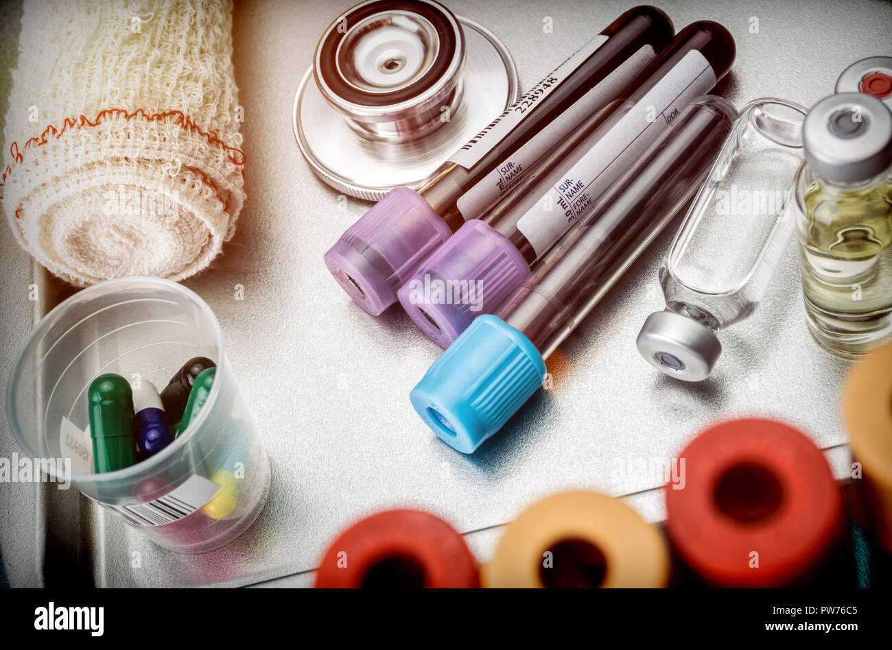 Vials and blood samples in a hospital tray, conceptual image Stock Photo