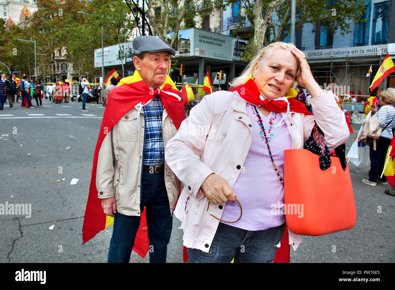 Middle aged couple at anti-Catalan independence rally, Barcelona, Spain. Stock Photo