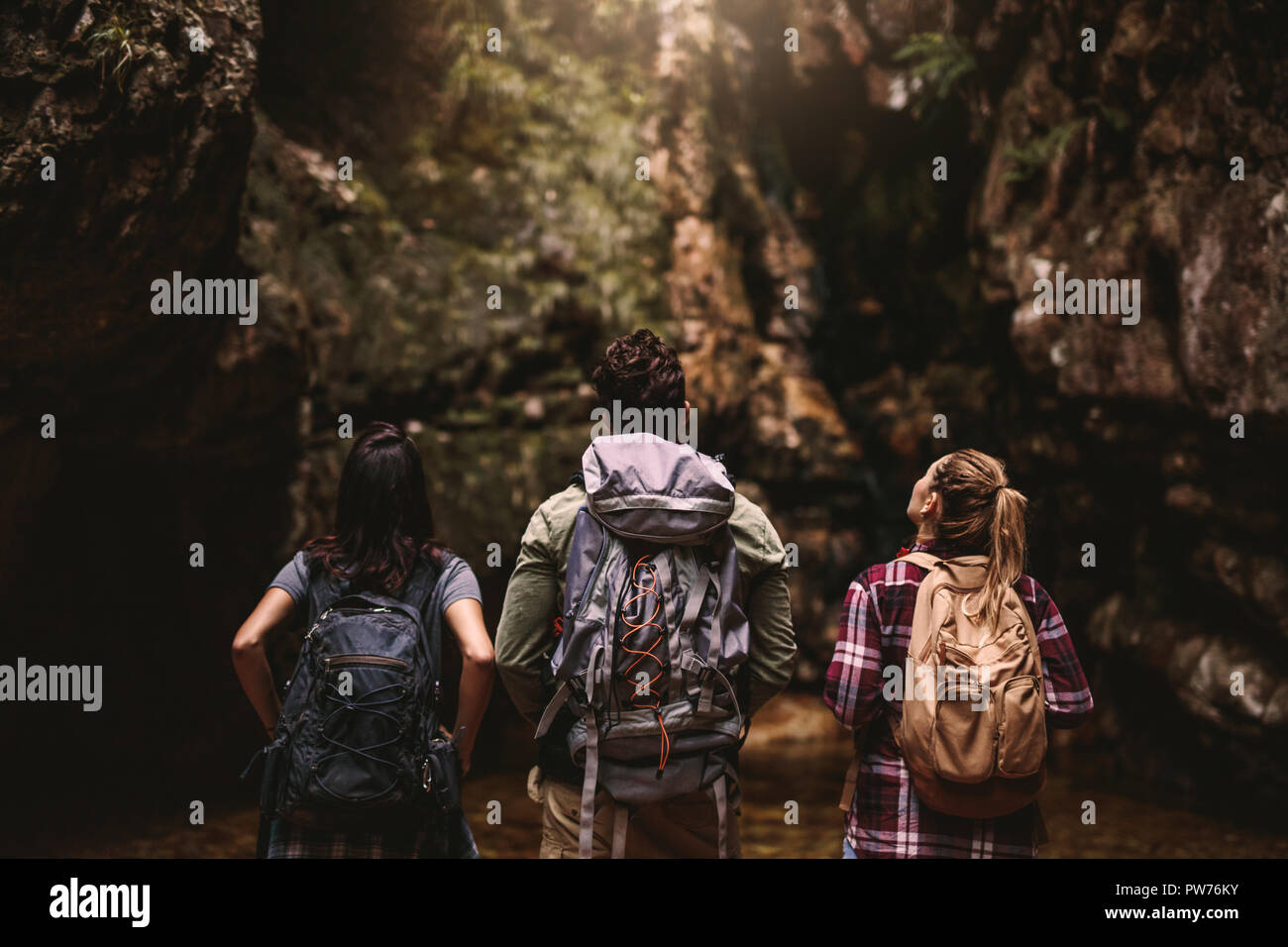 Back view three young people hi-res stock photography and images - Alamy