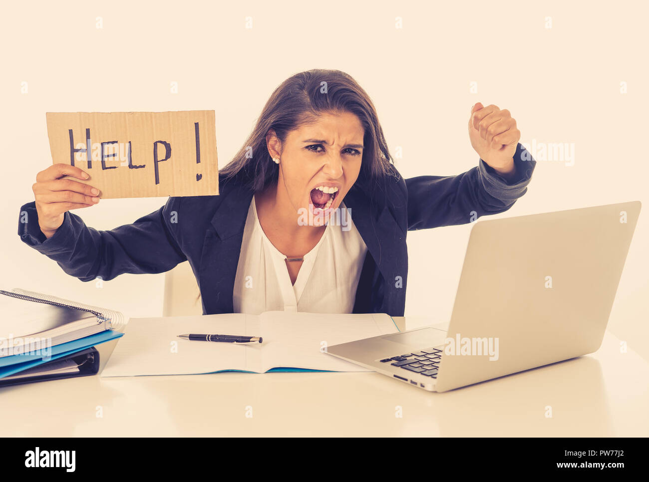 young-attractive-businesswoman-working-on-computer-laptop-suffering-stress-at-office-going-crazy-holding-a-help-sign-PW77J2.jpg