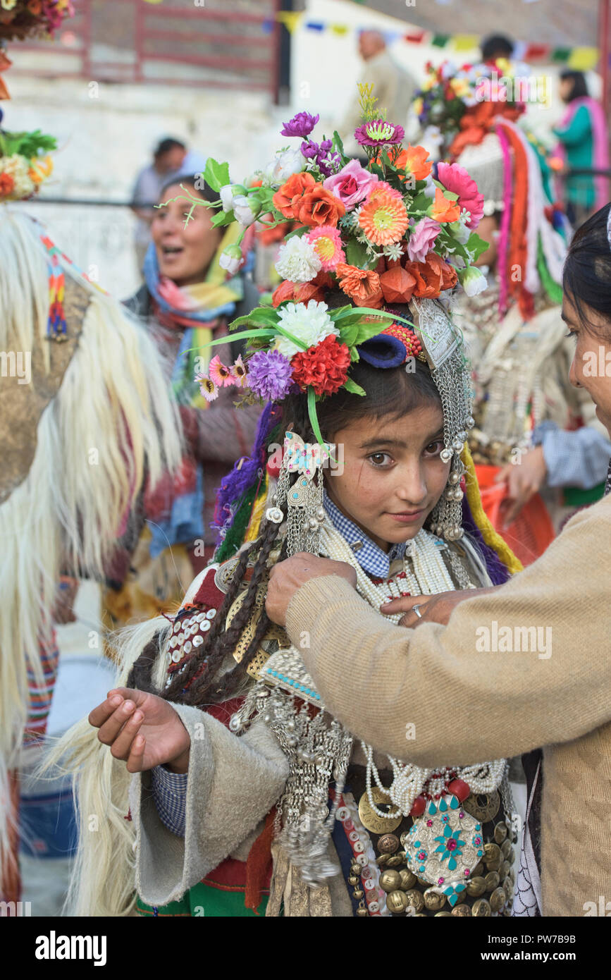 Aryan (Brogpa) girl being dressed for a festival, Biama village, Ladakh ...
