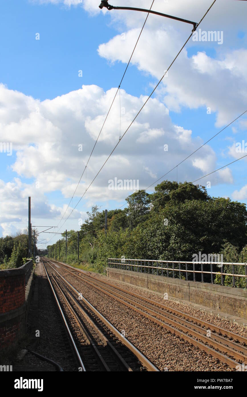 Railway tracks at a train station on a summer's day Stock Photo Alamy
