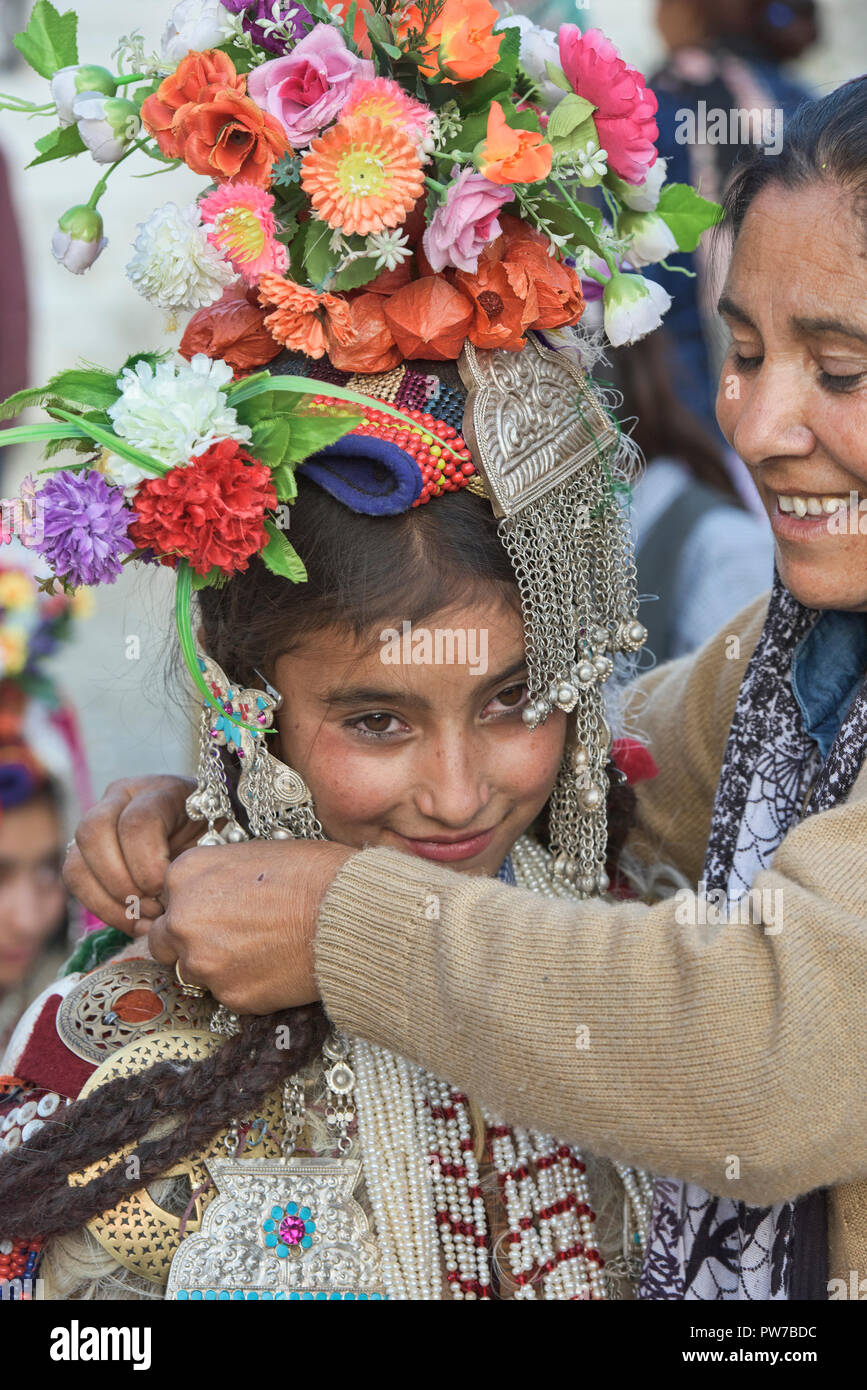 Aryan (Brogpa) girl being dressed for a festival, Biama village, Ladakh ...