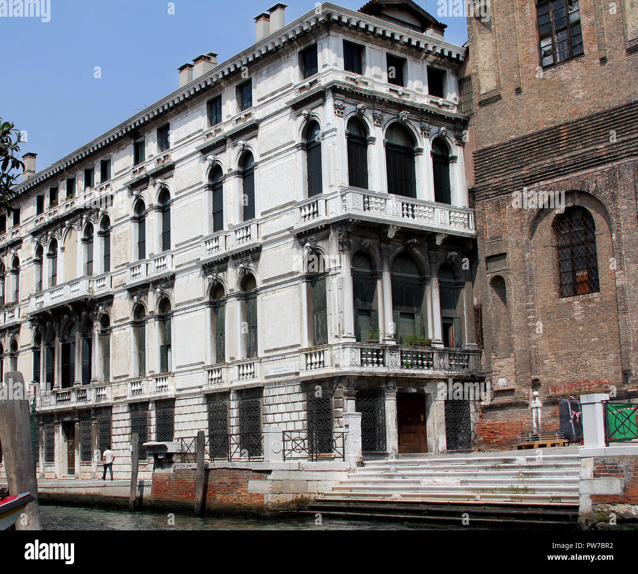 Despite being a city that is built on marshes and canals, and sinking, Venice still has many grand builds standing proud. Stock Photo