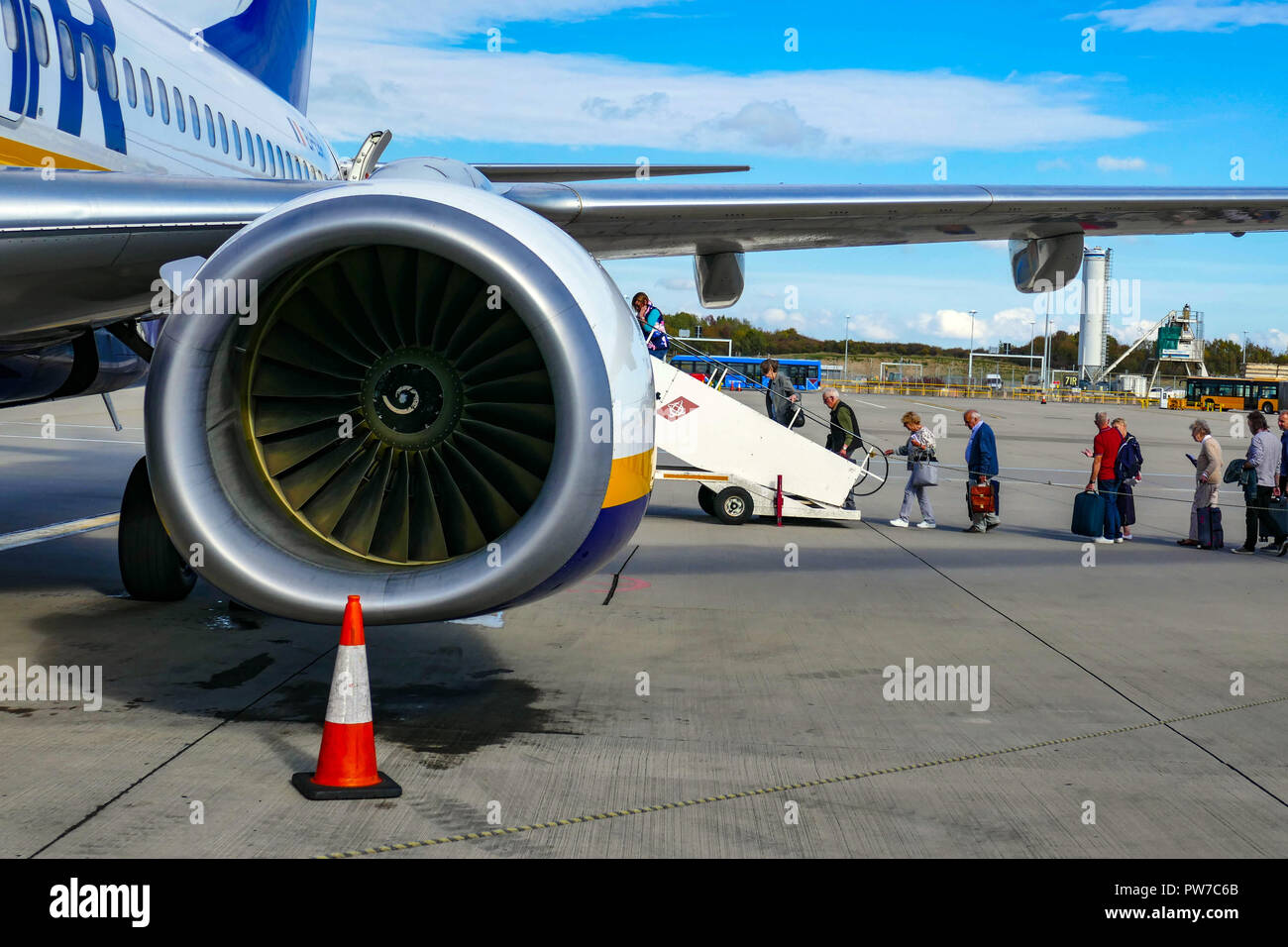 Passengers waiting by Ryanair Boeing 737 at London, Stansted airport, Stock Photo