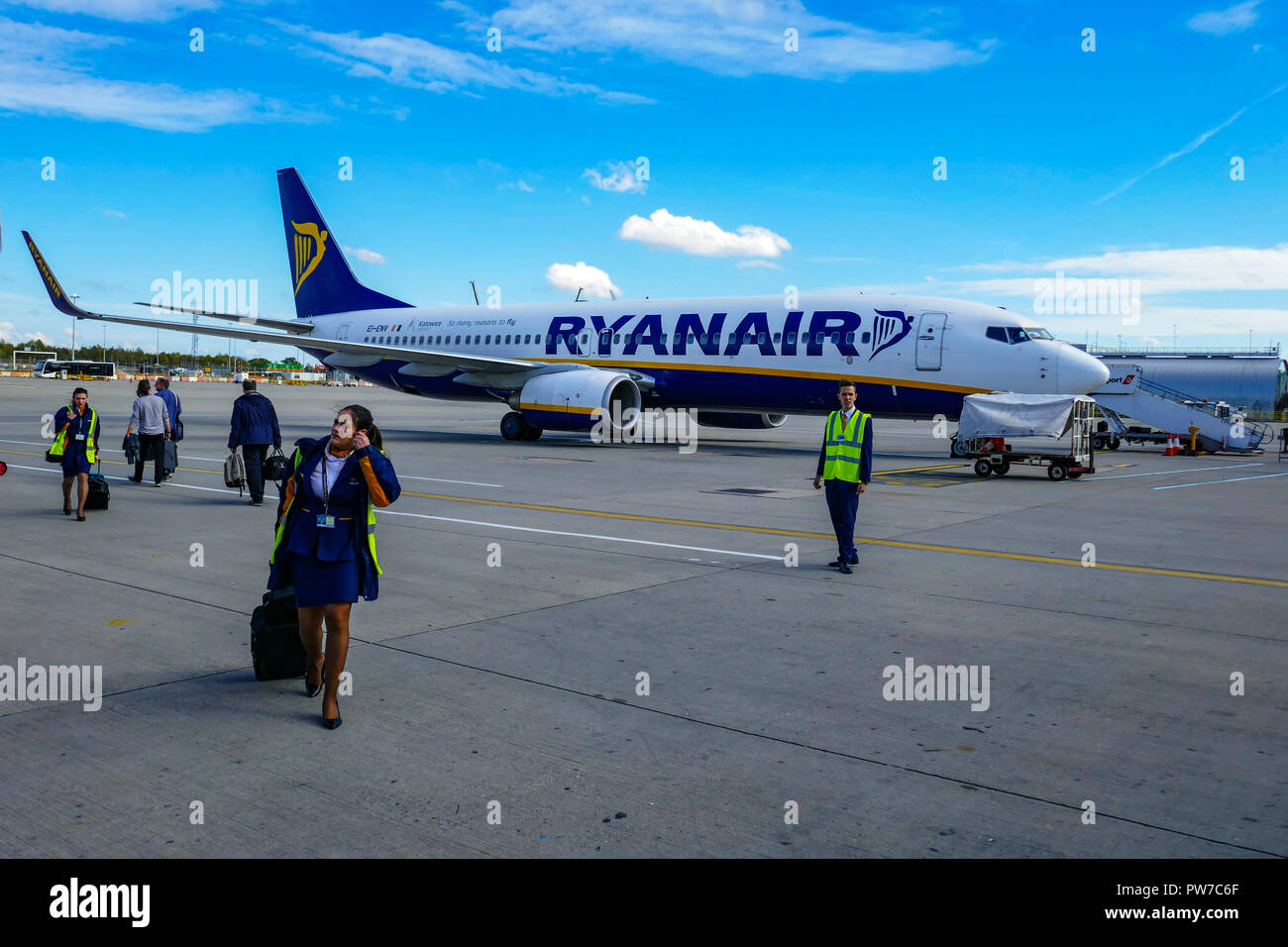 Passengers waiting by Ryanair Boeing 737 at London, Stansted airport, Stock Photo