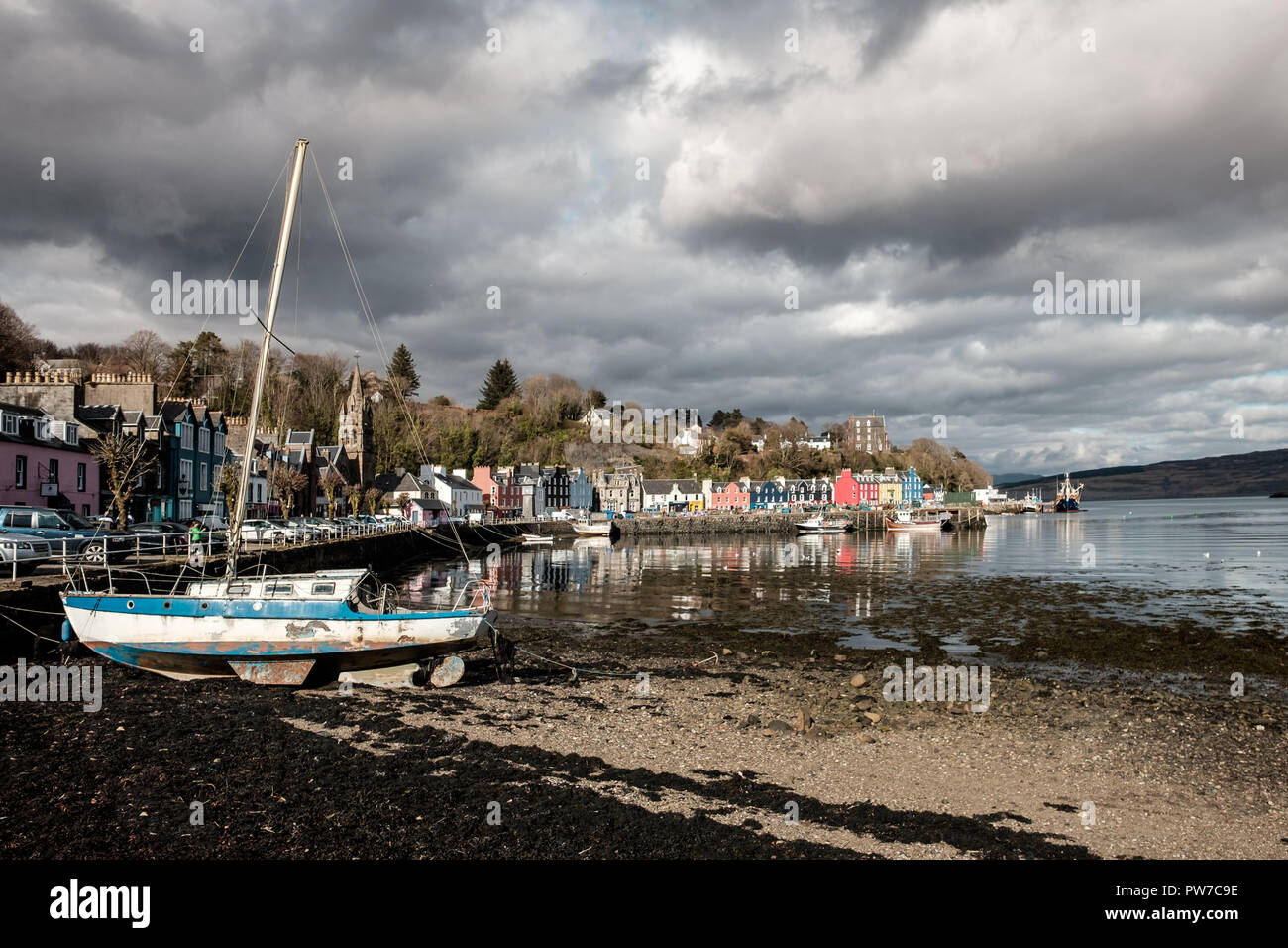 Old boat with view of Tobermory town in the background, Wednesday 11 April 2018, Tobermory, Scotland Stock Photo