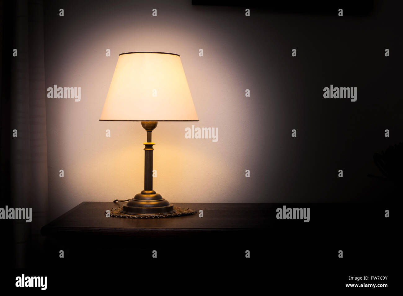 Lamp night light in a dark background. Vintage effect style picture.  Minimal concept Stock Photo - Alamy