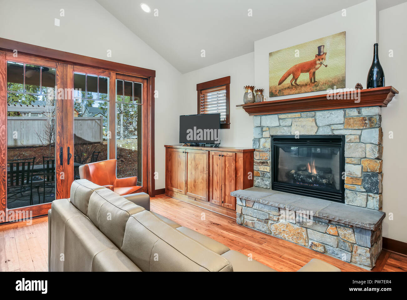 Adorable Living Room Interior With Stone Fireplace Wood Flooring