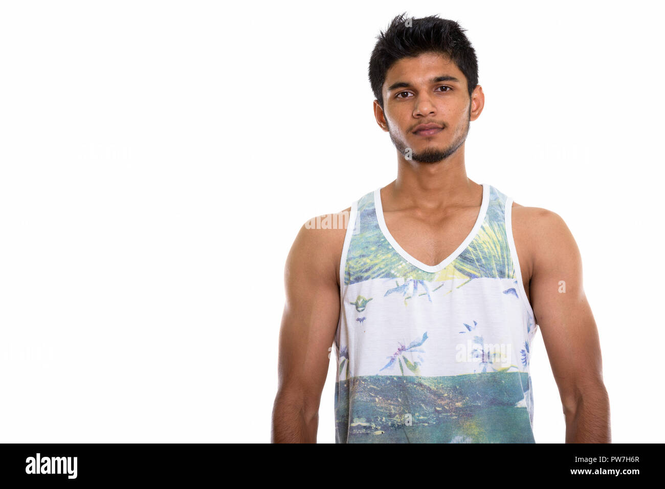 Studio shot of young handsome Indian man Stock Photo - Alamy