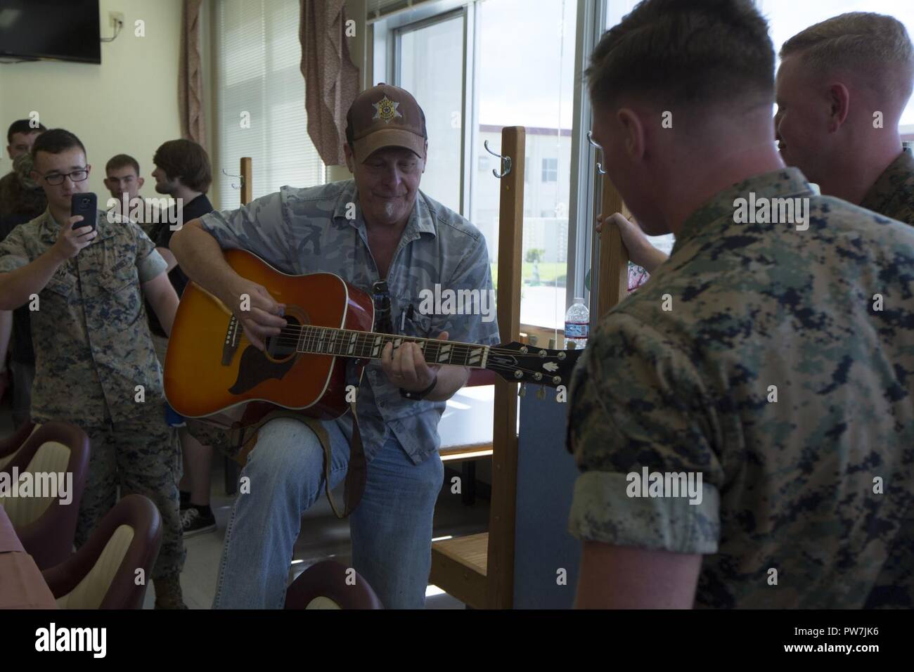 CAMP HANSEN, OKINAWA, Japan – Ted Nugent plays guitar for Marines during  lunch in the 12th Marines Chow Hall Sept. 24 before performing at Hansen  Fest aboard Camp Hansen, Okinawa, Japan. Nugent