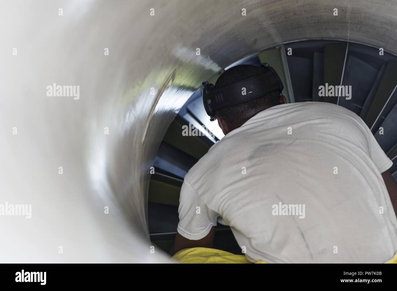 U.S. Air Force Tech. Sgt. Michael Kinsey, crew chief, 482nd Aircraft Maintenance Squadron, Homestead Air Reserve Base, Florida, conducts an aircraft intake inspection on an F-16C Viper from the 482nd Fighter Wing, after the aircraft returned home from being evacuated September 21, 2017. The aircraft of the fighter wing were evacuated to Texas in advance of Hurricane Irma’s landfall with Florida. Stock Photo