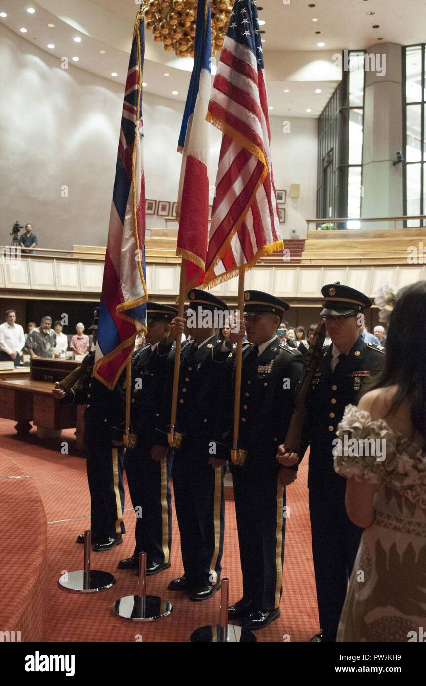 The 100th Battalion, 442nd Infantry Regiment, 9th Mission Support Command, Color Guard, led by Staff Sgt. Chris Arakawa, prepare to place the flags during the opening of the Legion D’Honneur ceremony at the Hawaii State Capitol, September 21. Stock Photo