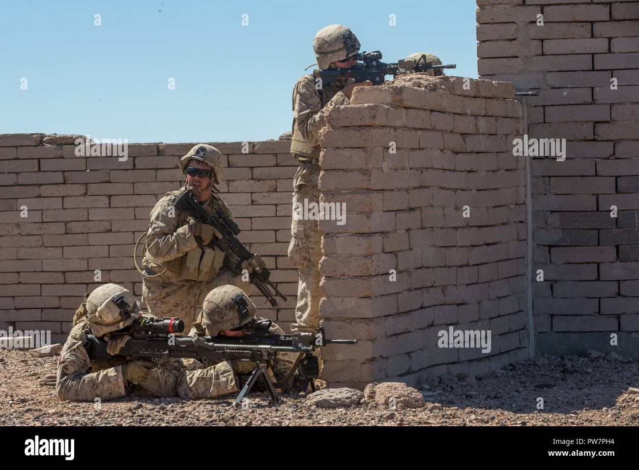 U.S. Marine Corps infantry Marines assigned to Kilo Company, 3rd Battalion, 1st Marines, conduct an urban training exercise during Weapons and Tactics Instructor Course (WTI) 1-18 in Yuma, Ariz., on Sept. 27, 2017. WTI is a seven week training event hosted by Marine Aviation Weapons Tactics Squadron One (MAWTS-1) cadre which emphasizes operational integration of the six functions of Marine Corps Aviation in support of a Marine Air Ground Task Force. MAWTS-1 provides standardized advanced tactical training and certification of unit instructor qualifications to support Marine Aviation Training a Stock Photo