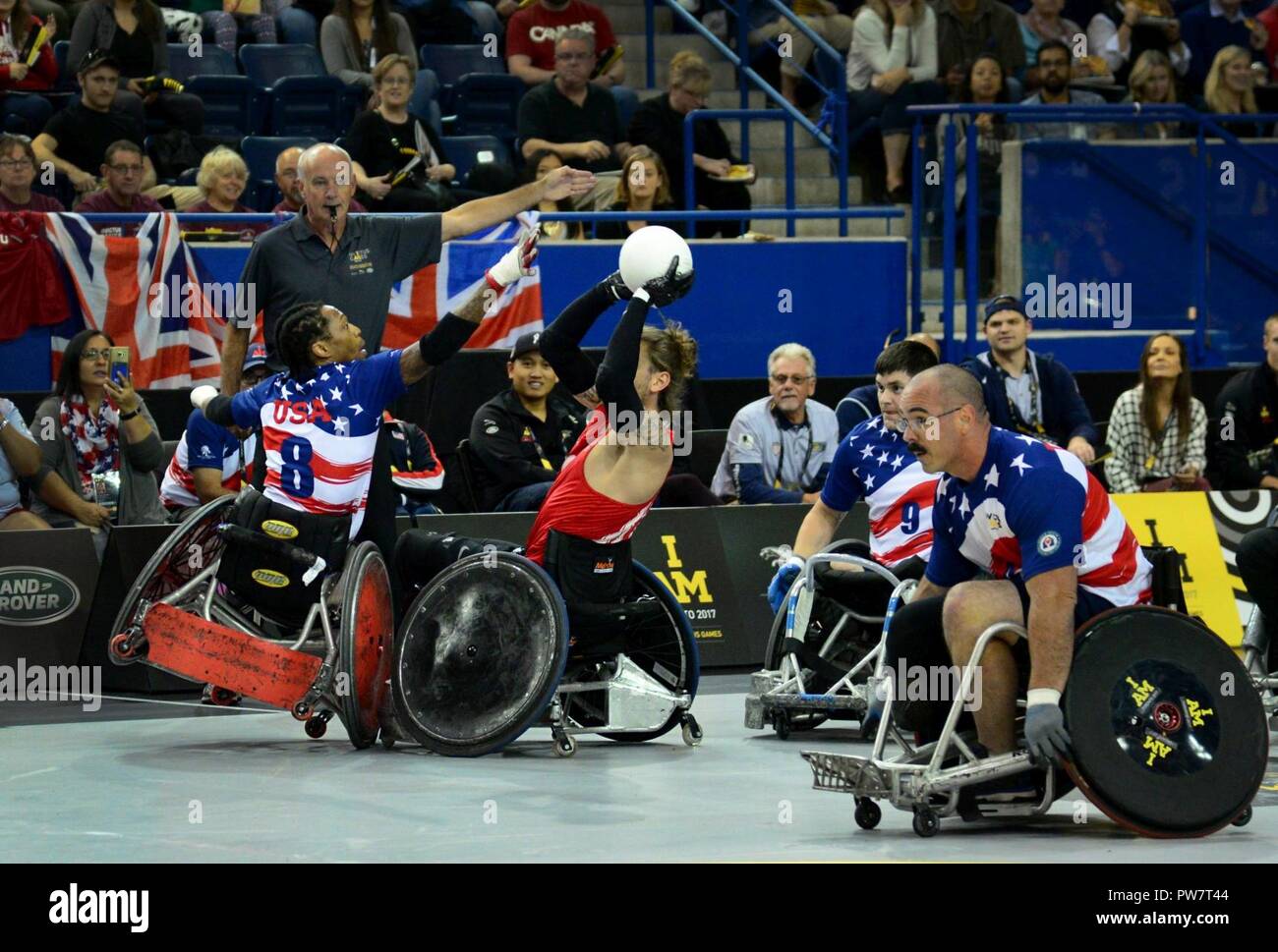 U.S. Marine Corps veteran Anthony McDaniel, a former sergeant and member of Team U.S., tries to block an opposing pass during wheelchair rugby finals at the 2017 Invictus Games in the Mattamy Athletic Centre in Toronto, Canada, Sept. 28, 2017. The Invictus Games were established by Prince Harry of Wales in 2014, and have brought together more than 550 wounded and injured veterans to take part in 12 adaptive sporting events. Stock Photo