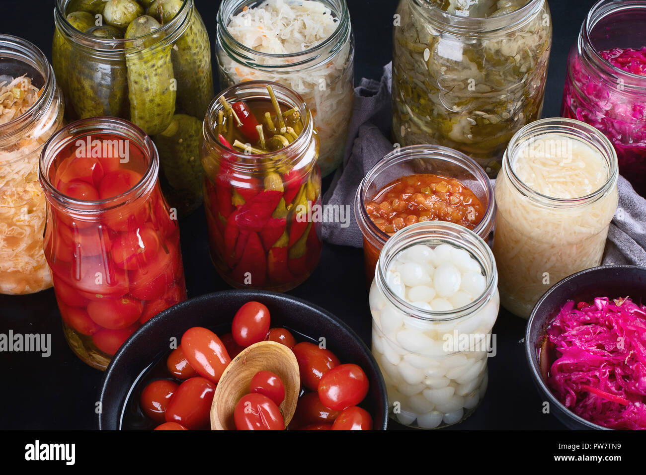 Fermented preserved food. Marinated pickles vegetables in glass jars