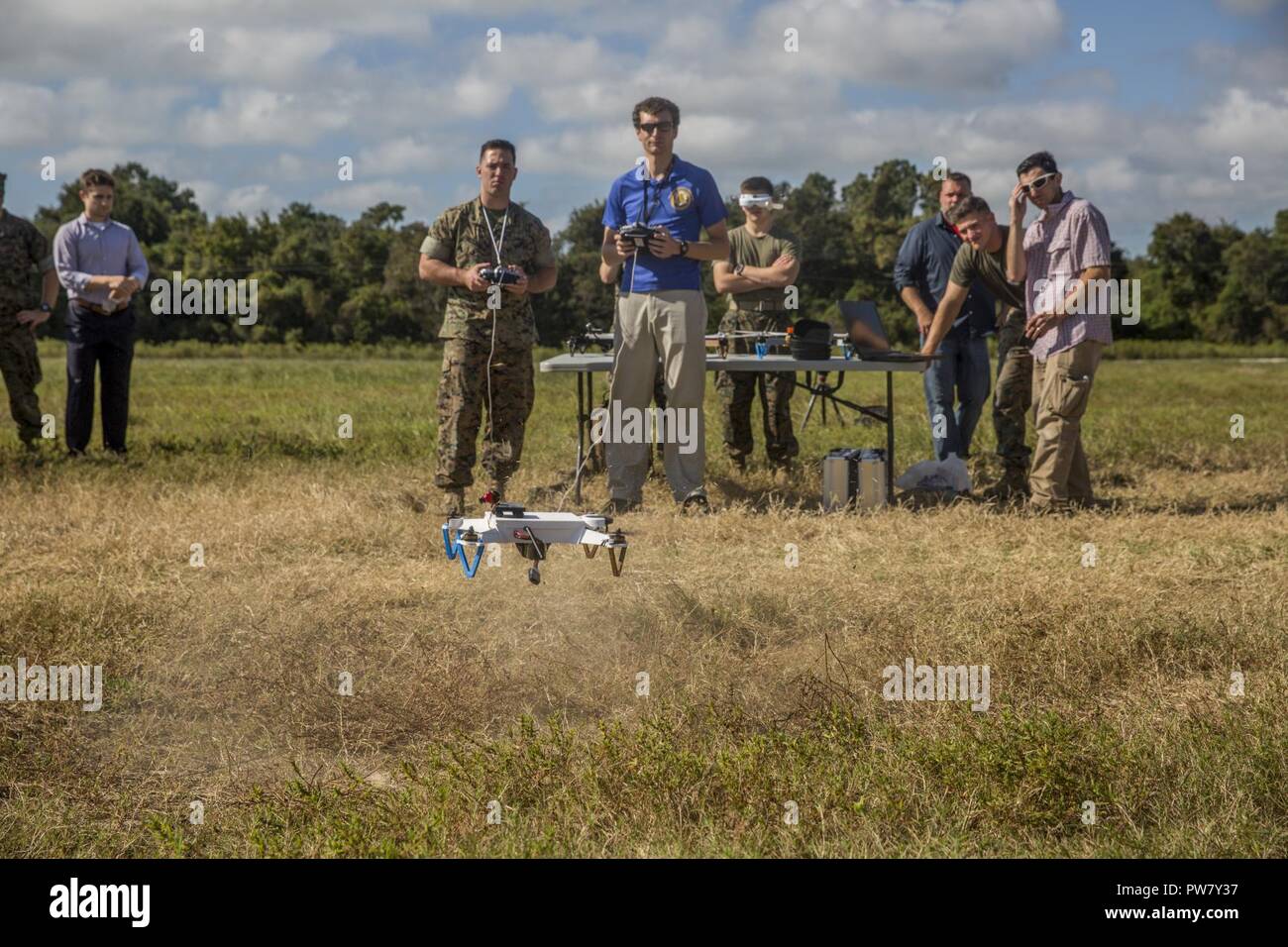 A Marine launches a small unmanned aerial system during a test flight